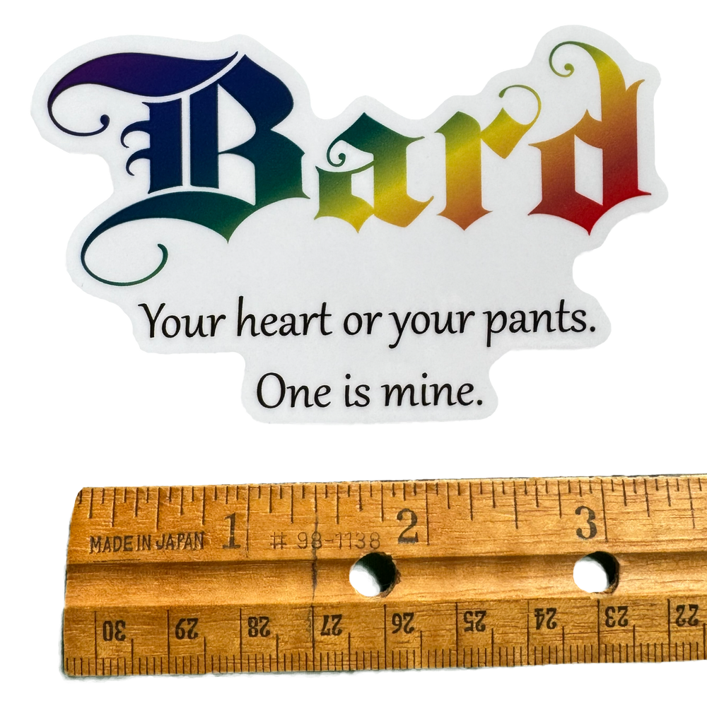The word Bard stretches across the design in vibrant rainbow colors — flowing through the letters with smooth gradients that shift through bold hues like stage lights hitting a performer mid-song. The color treatment gives it energy, charisma, and creative flair.

Below it sits the phrase:

“Your heart or your pants. One is mine.”

with a rule for size validity