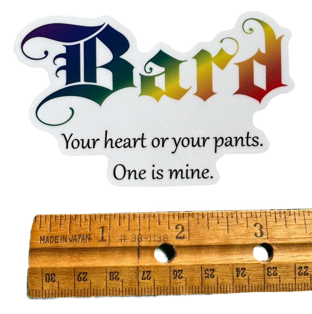 The word Bard stretches across the design in vibrant rainbow colors — flowing through the letters with smooth gradients that shift through bold hues like stage lights hitting a performer mid-song. The color treatment gives it energy, charisma, and creative flair.

Below it sits the phrase:

“Your heart or your pants. One is mine.”

with a rule for size validity