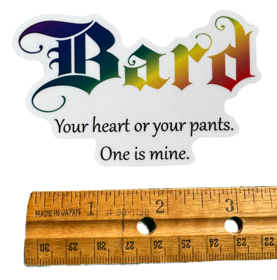 The word Bard stretches across the design in vibrant rainbow colors — flowing through the letters with smooth gradients that shift through bold hues like stage lights hitting a performer mid-song. The color treatment gives it energy, charisma, and creative flair.

Below it sits the phrase:

“Your heart or your pants. One is mine.”

with a rule for size validity