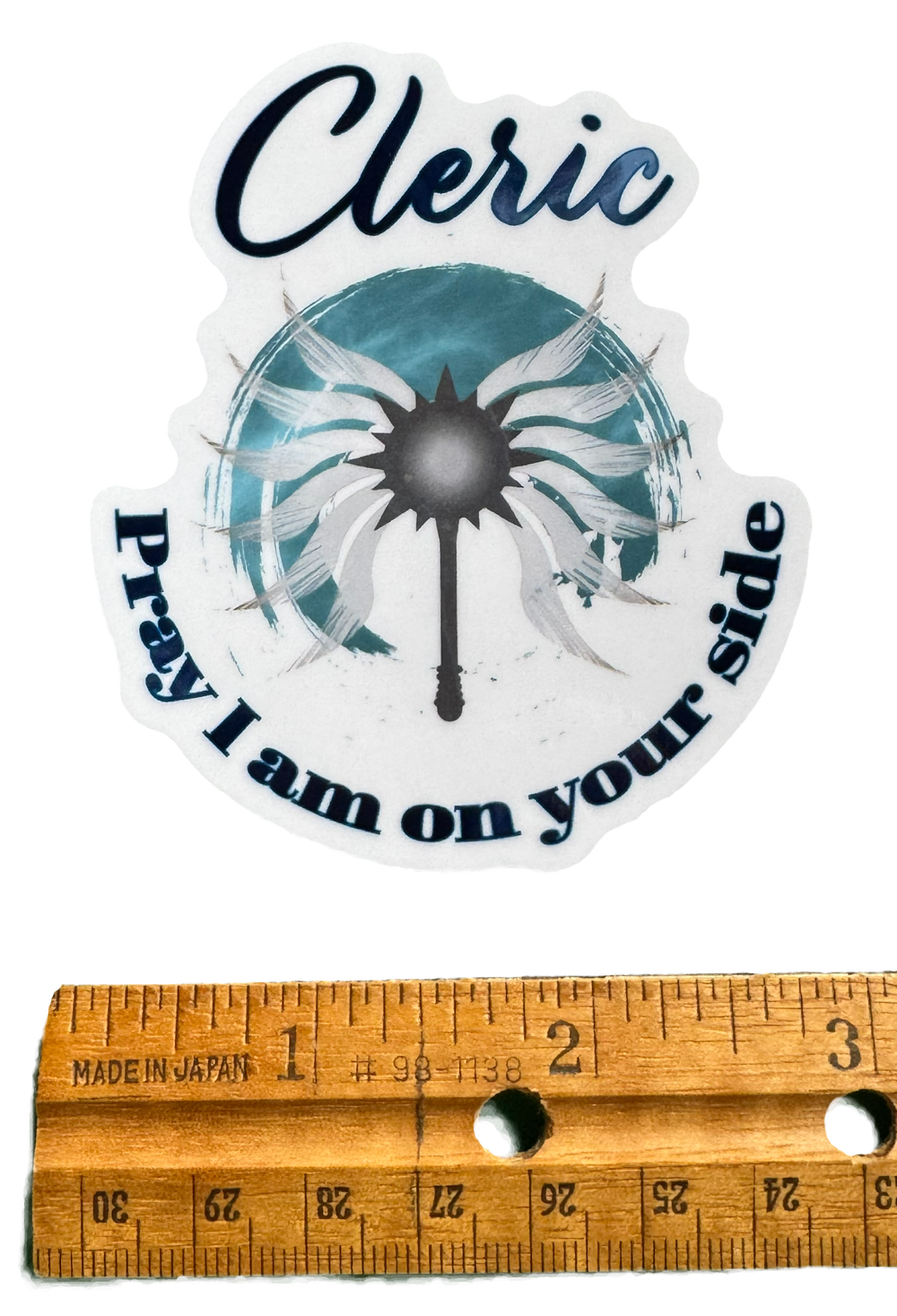 A powerful declaration of divine favor and battlefield protection. The word Cleric stands bold and grounded at the top, followed by the phrase:

“Pray I am on your side.”

with a ruler for size validity