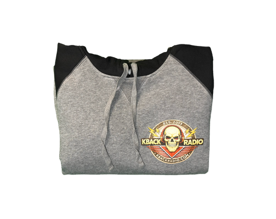 Folded image of artist-designed K-BACK Radio hoodie featuring a vintage-style broadcaster logo for a nostalgic.