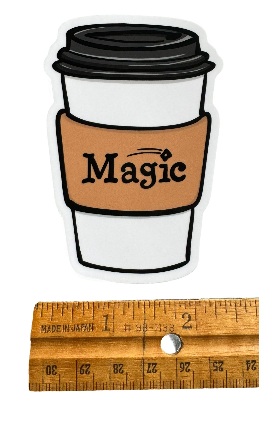 Whimsical Magic Coffee sticker. artist drawn sticker for coffee-loving gamers.
With a ruler for size validiation