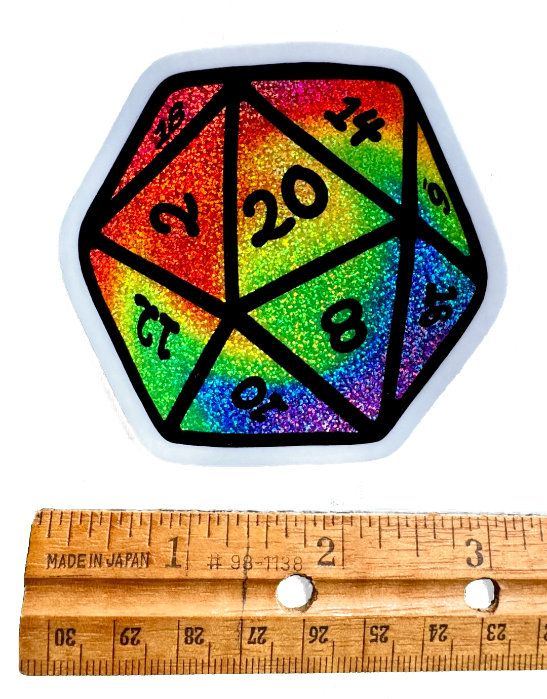 Colorful Rainbow Swirl D20 dice sticker, holographic fairy dust Glitter fantasy art for DnD players and tabletop gamers.
With a Ruler for Size Validity