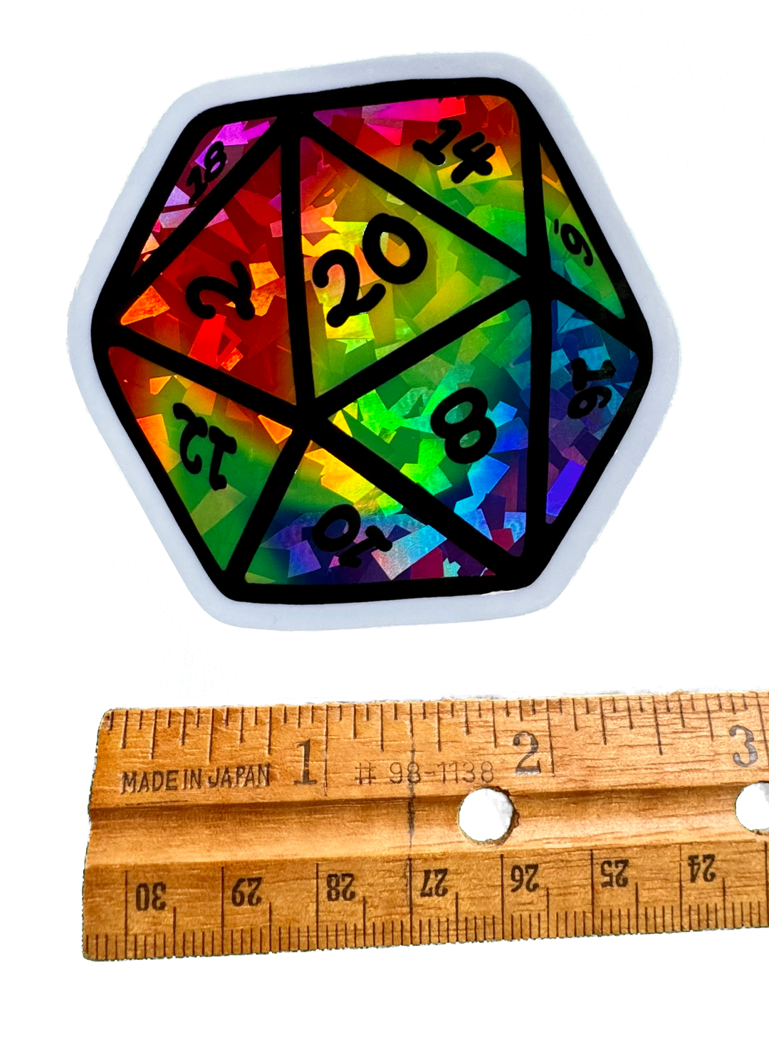Colorful Rainbow Swirl D20 dice sticker, holographic prisms fantasy art for DnD players and tabletop gamers.
With a ruler for size validity