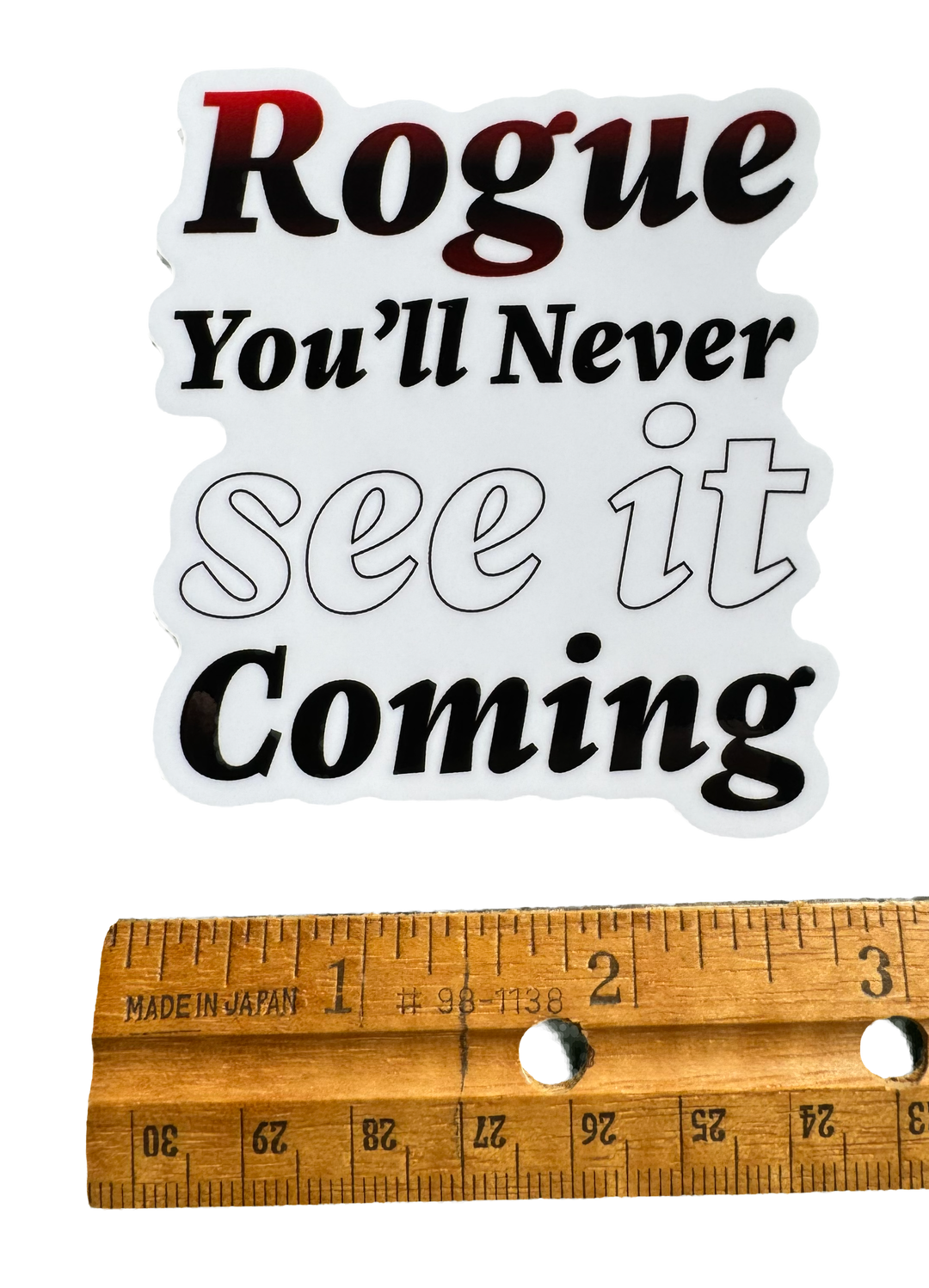 Stealth. Precision. Surprise.

The word Rogue sits at the center in sharp, confident typography — clean but edged with subtle distortion or shadow effects that hint at movement in the dark.

Beneath it, the phrase:

“You’ll never see it coming.”

with a ruler for size validity