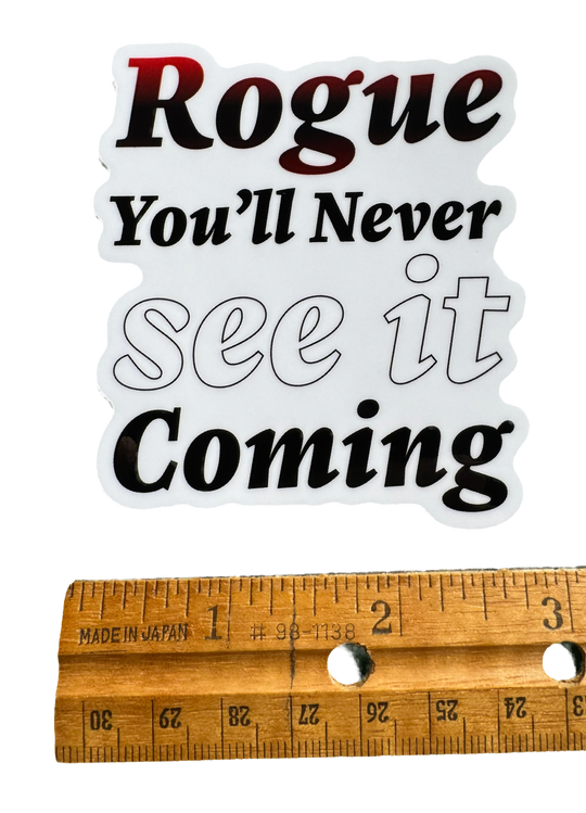 Stealth. Precision. Surprise.

The word Rogue sits at the center in sharp, confident typography — clean but edged with subtle distortion or shadow effects that hint at movement in the dark.

Beneath it, the phrase:

“You’ll never see it coming.”

with a ruler for size validity