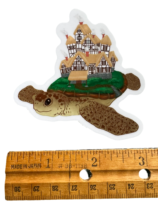 a sticker depicting strawberry the giant celestial flying turtle with a ruler for size validity
